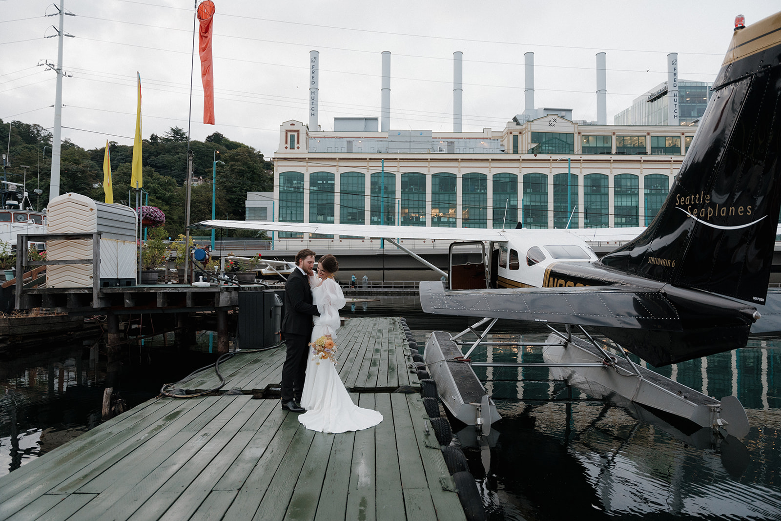 couple takes romantic portraits at Seaplanes on Lake Union for their Seattle elopement